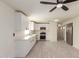 Open kitchen with stainless steel appliances and a ceiling fan at 241 S 54Th St, Mesa, AZ 85206