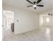 Open-concept living space with light wood-look flooring and a ceiling fan at 241 S 54Th St, Mesa, AZ 85206