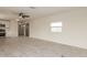 Open concept living room with modern kitchen, ceiling fan, and laminate floors at 241 S 54Th St, Mesa, AZ 85206