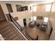 Bright, open-concept living room with soaring ceilings, tile floors, and an open stairway at 2454 E Stacey Rd, Gilbert, AZ 85298