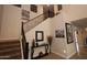 View of the staircase featuring dark wood with iron railings, leading to the second floor at 2454 E Stacey Rd, Gilbert, AZ 85298