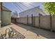 Spacious backyard featuring brick pathway, storage shed, and private fencing at 2538 N 8Th St, Phoenix, AZ 85006