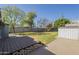 Large backyard featuring mature trees, lush lawn, and storage shed at 2538 N 8Th St, Phoenix, AZ 85006