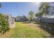 Expansive backyard featuring lush lawn, storage shed, and mature trees at 2538 N 8Th St, Phoenix, AZ 85006