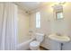 Clean, classic bathroom with tub and shower combination and pedestal sink at 2538 N 8Th St, Phoenix, AZ 85006