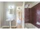 Vintage bathroom featuring classic fixtures, basin sink and tiled shower at 2538 N 8Th St, Phoenix, AZ 85006