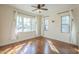 Bright bedroom with hardwood floors, large windows, and classic ceiling fan at 2538 N 8Th St, Phoenix, AZ 85006