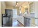 Kitchen featuring white cabinets, stainless steel appliances, ample counter space, and hardwood floors at 2538 N 8Th St, Phoenix, AZ 85006