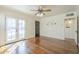 Bright living room featuring hardwood floors, ceiling fan, and french doors to maximize natural light at 2538 N 8Th St, Phoenix, AZ 85006