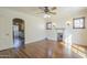 Bright living room featuring hardwood floors, an archway, and a fireplace to maximize space at 2538 N 8Th St, Phoenix, AZ 85006