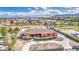 Expansive aerial view of custom home with desert landscaping, circular driveway, and a distant mountain view at 25903 S Lemon Ave, Queen Creek, AZ 85142