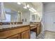 Bathroom featuring granite counter tops, double sinks, and ample lighting at 25903 S Lemon Ave, Queen Creek, AZ 85142