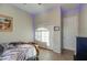 Bedroom with a ceiling fan, neutral walls, and a closet with sliding doors at 25903 S Lemon Ave, Queen Creek, AZ 85142