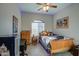 Cozy bedroom with blue LED accent lighting and a classic wooden bed frame at 25903 S Lemon Ave, Queen Creek, AZ 85142