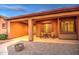 Inviting covered patio with outdoor seating, creating a cozy and welcoming entrance to the home at 25903 S Lemon Ave, Queen Creek, AZ 85142