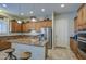 Well-equipped kitchen with granite countertops, stainless steel appliances, and ample cabinet space at 25903 S Lemon Ave, Queen Creek, AZ 85142