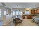 Open kitchen and dining area featuring a wooden table, and lots of natural light at 25903 S Lemon Ave, Queen Creek, AZ 85142