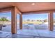 Covered patio features decorative columns and outdoor views of the pool area at 25903 S Lemon Ave, Queen Creek, AZ 85142