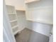 Walk-in closet with built-in shelves and ample storage for an organized wardrobe and personal items at 25912 N Langley Dr, Peoria, AZ 85383