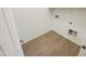 A dedicated laundry room with tile floors and hookups and featuring white walls at 25912 N Langley Dr, Peoria, AZ 85383