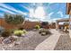 Expansive backyard featuring stone landscaping, a covered patio and relaxing seating areas at 25983 W Escuda Dr, Buckeye, AZ 85396