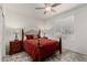 Well-lit bedroom featuring a wrought iron bed frame and neutral walls at 25983 W Escuda Dr, Buckeye, AZ 85396