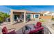 Paver patio with outdoor seating, mature landscaping and BBQ make this the perfect outdoor living space at 25983 W Escuda Dr, Buckeye, AZ 85396