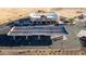 High angle aerial view of a neighborhood gas station and retail complex with convenient access and parking at 27138 W Escuda Dr, Buckeye, AZ 85396