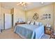 Comfortable bedroom featuring a large bed, decorative wall plates, and neutral decor creates a relaxing atmosphere at 27138 W Escuda Dr, Buckeye, AZ 85396