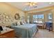 Cozy bedroom with a large window letting in plenty of natural light, complemented by neutral walls and light-colored carpet at 27138 W Escuda Dr, Buckeye, AZ 85396