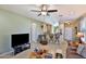 Inviting living space featuring tile flooring and an open layout to the kitchen area at 27138 W Escuda Dr, Buckeye, AZ 85396