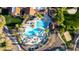 Aerial view of a resort-style community pool area with ample seating and lush landscaping at 27138 W Escuda Dr, Buckeye, AZ 85396