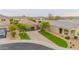 Stunning aerial view of a single-Gathering home featuring a tile roof, two-car garage, and lush landscaping at 29219 W Clarendon Ave, Buckeye, AZ 85396