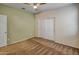 Neutral-toned bedroom featuring carpet, a ceiling fan, and a large closet with double doors at 29219 W Clarendon Ave, Buckeye, AZ 85396