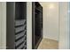 Custom closet with built-in shelving and drawer storage at 29219 W Clarendon Ave, Buckeye, AZ 85396