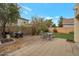 Backyard featuring stone patio area with outdoor furniture, low-maintenance landscaping, and block wall at 3049 E Santa Rosa Dr, Gilbert, AZ 85234