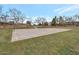 Outdoor basketball court on a grassy area, with mature trees in the background at 3049 E Santa Rosa Dr, Gilbert, AZ 85234