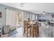 Well lit dining area with wood flooring, a ceiling fan, and sliding glass doors to the backyard at 3049 E Santa Rosa Dr, Gilbert, AZ 85234