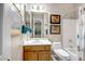 Bright bathroom features a single sink vanity and shower-tub combo with neutral wall decor at 3108 W Ravina Ln, Anthem, AZ 85086