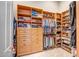 Walk-in closet features custom shelves, drawers and closet rods at 3108 W Ravina Ln, Anthem, AZ 85086