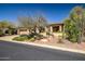 Charming desert home with well-maintained landscaping, a two-car garage, and a welcoming front entrance at 3108 W Ravina Ln, Anthem, AZ 85086