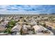 A panoramic aerial perspective of a desert community with lush greenery and mountain views at 3317 W Knudsen Dr, Phoenix, AZ 85027