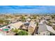 Picturesque aerial view of desert homes, a local park, and distant mountain scenery at 3317 W Knudsen Dr, Phoenix, AZ 85027