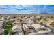 Wide aerial showing a desert community with landscaping and mountain views under a blue sky at 3317 W Knudsen Dr, Phoenix, AZ 85027