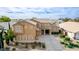 Aerial view of a two-story home with neutral color scheme, long driveway, and desert landscaping at 3317 W Knudsen Dr, Phoenix, AZ 85027