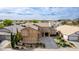 Spacious two-story home with desert landscaping, attached garage, and wide driveway at 3317 W Knudsen Dr, Phoenix, AZ 85027