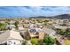 Expansive aerial view of a desert neighborhood featuring single-Gathering homes and mountain views at 3317 W Knudsen Dr, Phoenix, AZ 85027