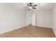 Simple bedroom with light walls, wood-look floors, and an open doorway at 3317 W Knudsen Dr, Phoenix, AZ 85027