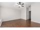 Inviting bedroom with wood-look floors and a modern ceiling fan at 3317 W Knudsen Dr, Phoenix, AZ 85027