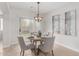 Inviting dining area with stylish lighting, neutral tones, and sliding door access at 3317 W Knudsen Dr, Phoenix, AZ 85027